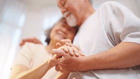 Happy Asian family senior couple hugging and holding hands together. Elderly husband and wife enjoy indoor lifestyle relaxing at home. Family relationship, Aged people mental healthcare concept. - Powered by Shutterstock - Get 15% off with code: PIKWIZARD15