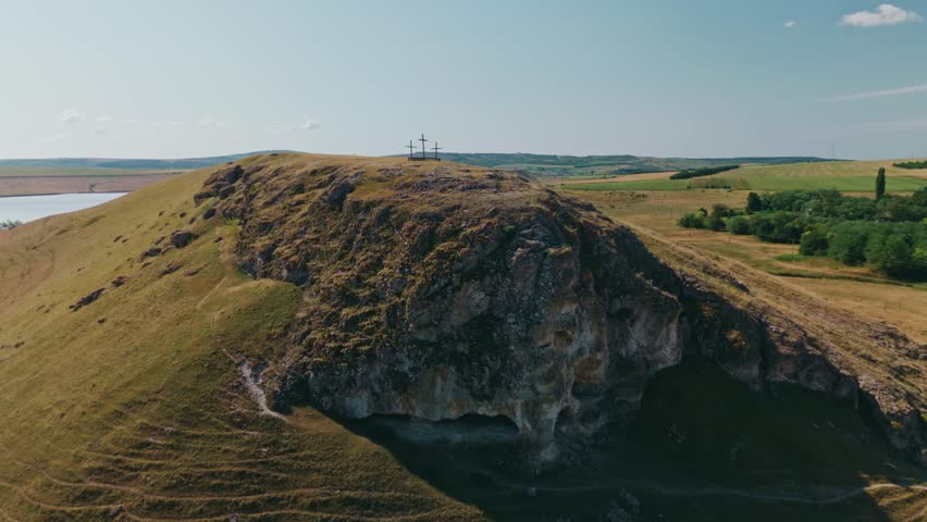 A stunning aerial view showcasing a breathtaking, scenic hill landscape located near calm water