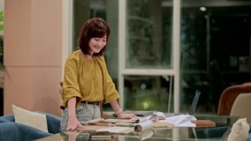 Focused southeast asian woman interior designer working from home office on new house design project, choosing flooring, furniture, materials, and color samples for renovation - Powered by Shutterstock - Get 15% off with code: PIKWIZARD15