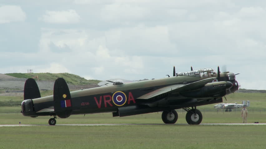 Avro Lancaster bomber plane from World War II starts its engines.