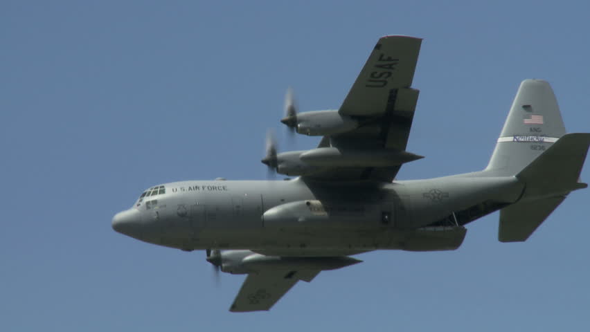 Lockheed Hercules military transport aircraft in flight.