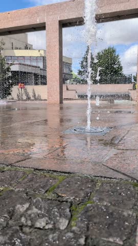 Modern Fountain located in an Urban Space that features Clear and Beautiful Reflections