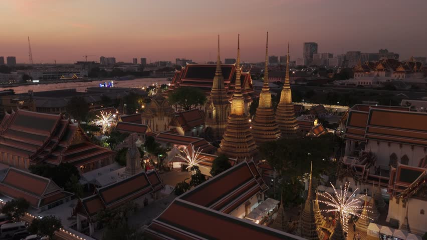 Wat pho temple at sunset, Bangkok, Thailand. Wat pho temple complex, revealing bangkok's historic architectural beauty against vibrant evening skyline