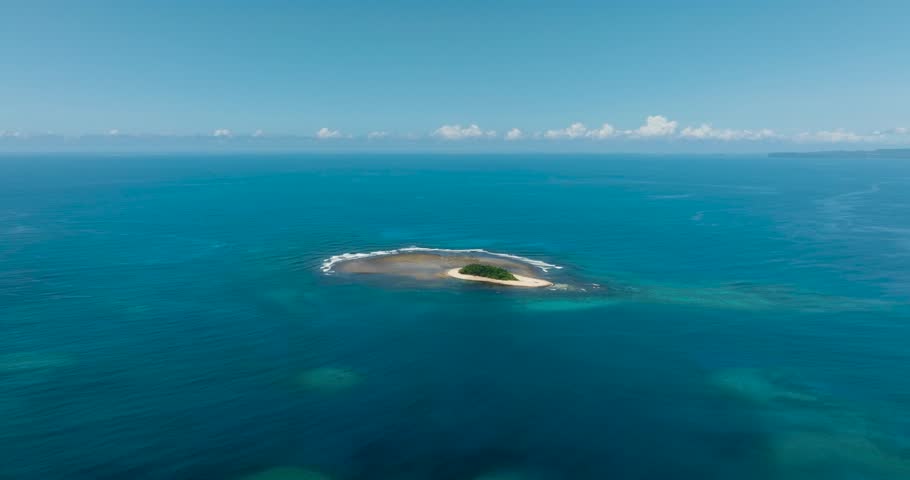 Blue sea and white sand beach in tropical islet. Jobo Island.m Surigao del Sur, Philippines.