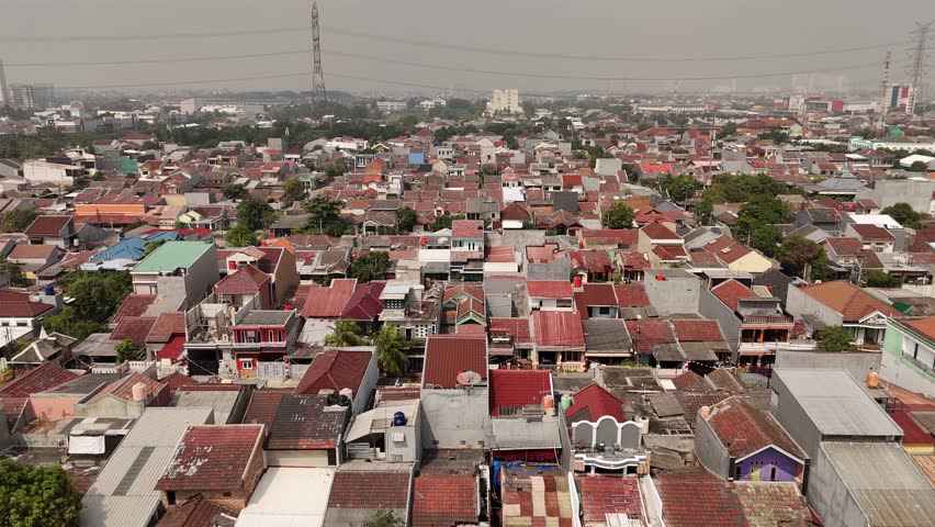  Aerial drone view of densely populated urban neighborhood with narrow streets and compact housing. city planning, social documentaries, and urban development concept