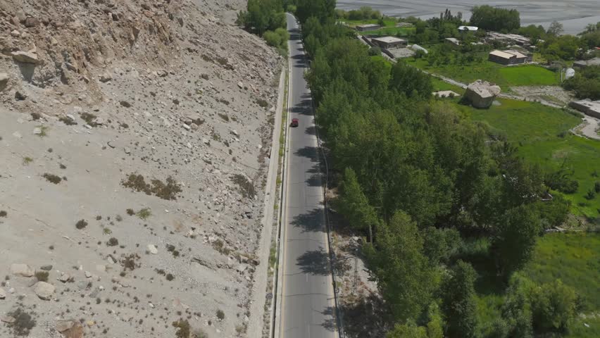 Aerial view of road and trees in Hunza Nagar, Pakistan.