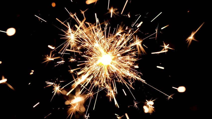 sparkler on black background. lights burning. Holiday party. New year party real sparkler. 4K. burning sparkler on chroma key green screen isolated for overlay. birthday cake. red Yellow flame fire
