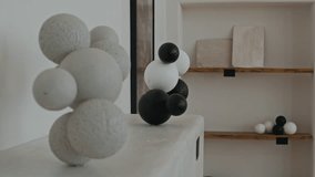 Rotating shot of abstract art sculpture made of concrete spheres presented on podium during art gallery exhibition no people - Powered by Shutterstock - Get 15% off with code: PIKWIZARD15