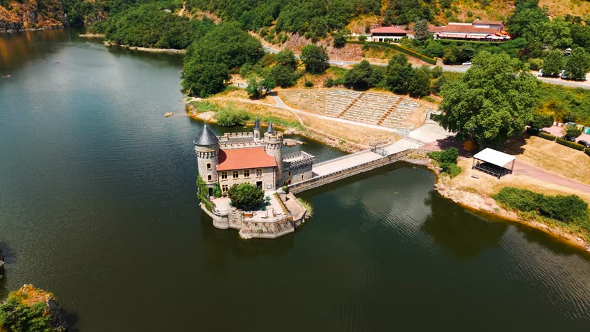 aerial shot above the Chateau de la roche revealing the Loire river and the landscape behing near Roanne in Loire departement, Auvergne Rhone Alpes region, France