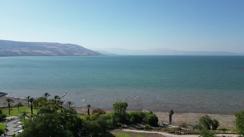 Peaceful scenic view of the Sea of Galilee in Israel. Calm blue waters, distant hills, and natural light create a serene and timeless Middle Eastern landscape.