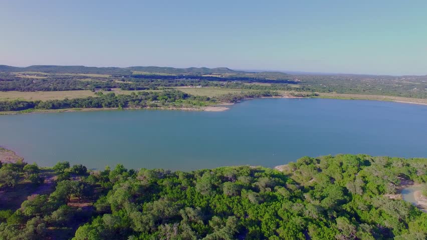 Flying Drone Over Small Lake