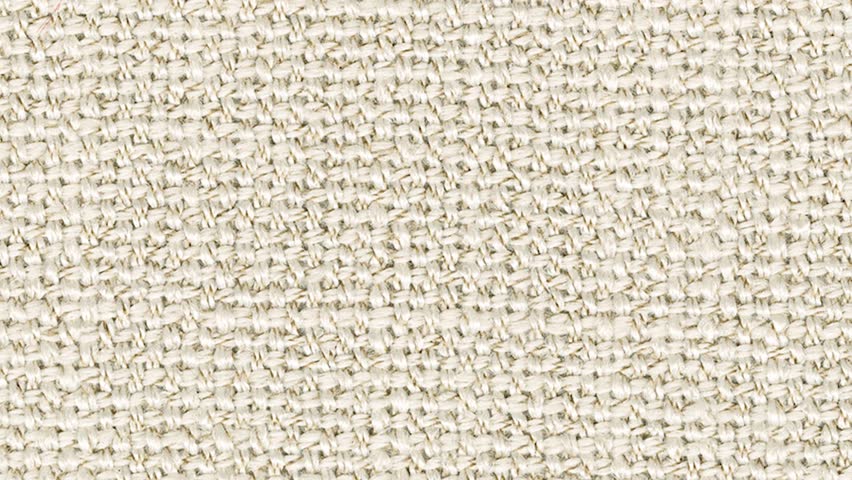 Camera slowly zooms into stringy beige weave in extreme detail