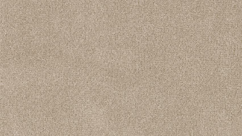 Camera slowly zooms into dense brown fibers, highlighting detailed weave