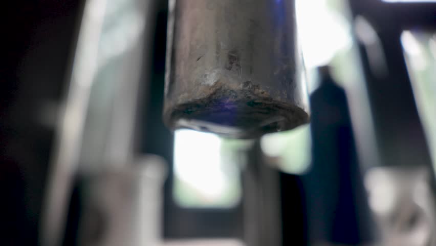 A detailed view of a rusted faucet dripping water, emphasizing texture and motion. slow motion - Powered by Shutterstock - Get 15% off with code: PIKWIZARD15