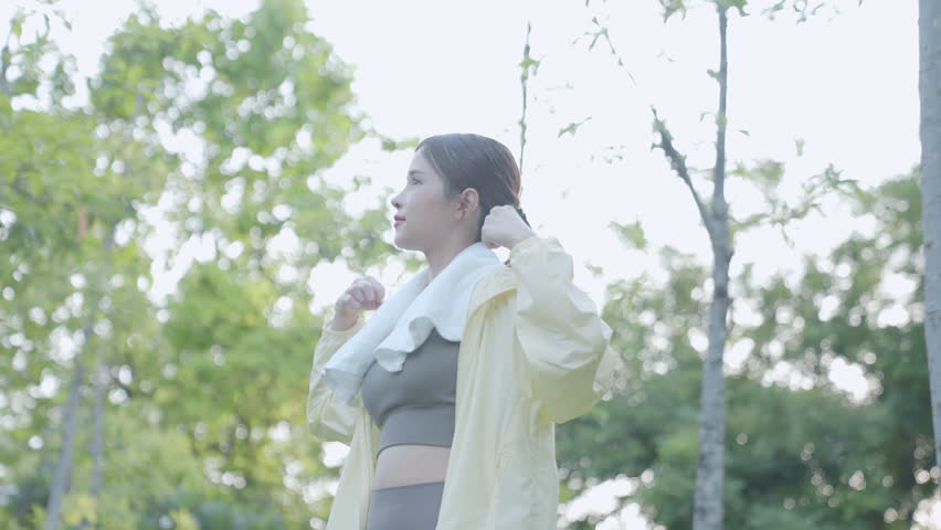 Asian women are healthy. They wake up early to exercise in the park. There are many trees that make them feel refreshed. Their favorite sports are running and yoga. Health care.