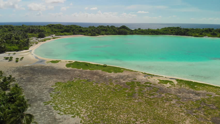 Aerial shot of beaches and lagoon of Nikumaroro Atoll, Kiribati