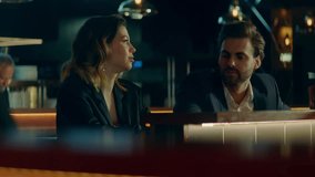Beautiful Caucasian couple having a date in a stylish restaurant, talking and laughing. Shot with 2x anamorphic lens - Powered by Shutterstock - Get 15% off with code: PIKWIZARD15