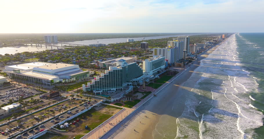 Daytona Beach, Florida. Tourist infrastructure with brightly colored hotels, condos and recreational facilities in vibrant coastal setting.