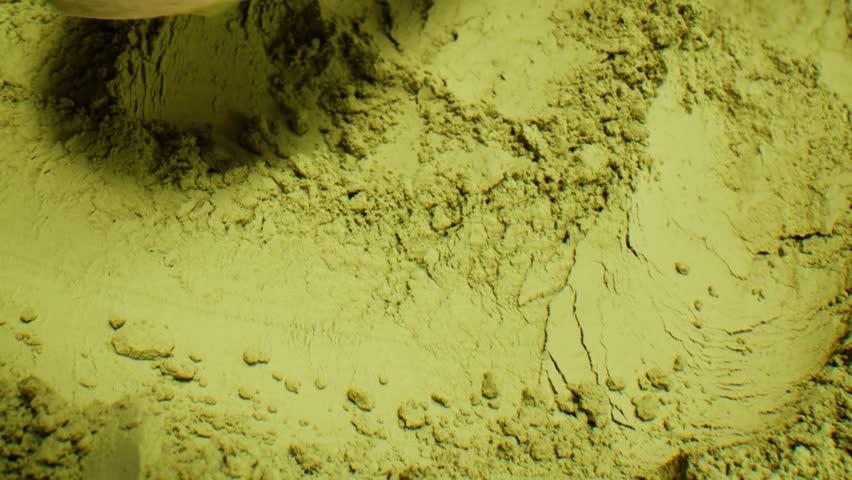 Matcha green tea cooking process, japanese powder green tea in a bowl with bamboo whisk, macro close up in cafe of powder green tea. 