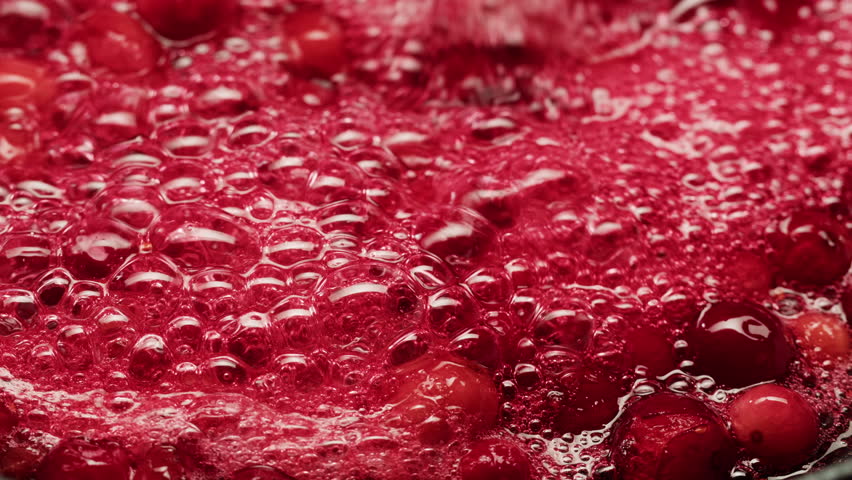 Frozen cranberries cooking for tea or jam, Background Close up of cranberry berries in on the kitchen, chef making dessert healthy pie.
