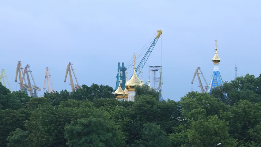 Ventspils, Latvia A moving view of the Ventspils St. Nicholas Orthodox Church and the port. 
