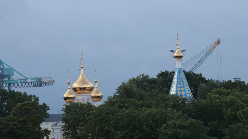 Ventspils, Latvia A moving view of the Ventspils St. Nicholas Orthodox Church and the port. 
