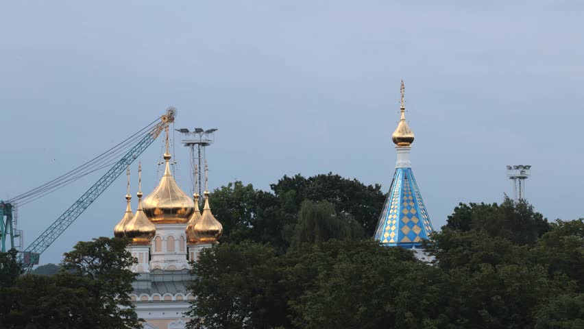 Ventspils, Latvia A moving view of the Ventspils St. Nicholas Orthodox Church and the port. 

