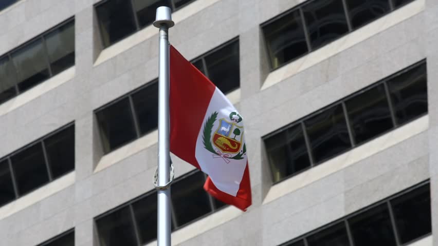 The Peruvian flag on a flag pole at Toronto Ciry Hall’s Nathan Phillips Square.