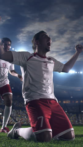 Soccer Players Celebrating Goal in Stadium — Vertical Video