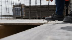 Worker hammering nail on construction formwork - Powered by Shutterstock - Get 15% off with code: PIKWIZARD15