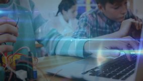 Child boy inserting wire into circuit board with classmate typing code animating STEM overlay. Educational, technology, innovation, collaboration, learning, youthful, futuristic - Powered by Shutterstock - Get 15% off with code: PIKWIZARD15