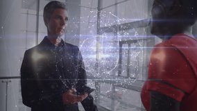 Mature woman using smartphone generating spinning holographic data globe during business briefing. Futuristic, collaboration, innovation, technology, corporate, networking, visualization - Powered by Shutterstock - Get 15% off with code: PIKWIZARD15