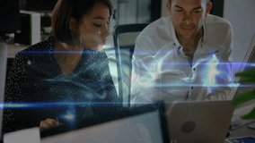 Woman navigating laptop creating data overlay, male colleague pointing at chart for tech analysis. Collaboration, teamwork, digital, innovation, analysis, professionals, office - Powered by Shutterstock - Get 15% off with code: PIKWIZARD15