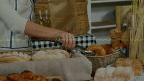 Female bakery clerk picking tongs, selecting plain bagel and placing into paper bag for handoff. Bakery, artisan, rustic, hospitality, retail, bakedgoods, freshness - Powered by Shutterstock - Get 15% off with code: PIKWIZARD15
