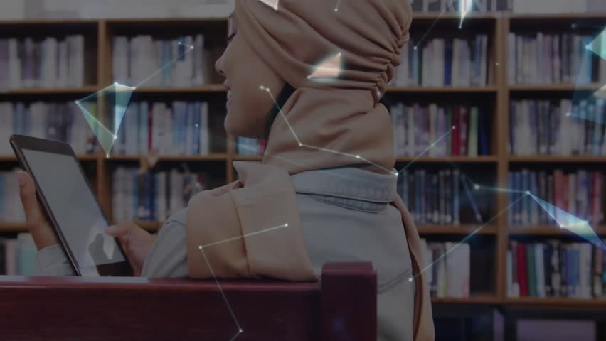 Student tapping tablet in library initiating nodes forming globe above open palm showing connection. Digital, connectivity, innovation, futuristic, knowledge, collaboration, education - Powered by Shutterstock - Get 15% off with code: PIKWIZARD15