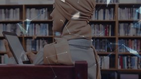 Student tapping tablet in library initiating nodes forming globe above open palm showing connection. Digital, connectivity, innovation, futuristic, knowledge, collaboration, education - Powered by Shutterstock - Get 15% off with code: PIKWIZARD15