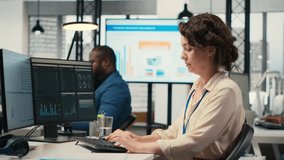 Diverse corporate staff working together on report writing in the office, collaborating on building a new development strategy. Reviewing insights to enhance efficiency and progress. Camera B. - Powered by Shutterstock - Get 15% off with code: PIKWIZARD15