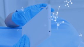 Animation of molecules flowing over female doctor with face mask using digital tablet. Medical dental treatment Covid 19 coronavirus protection concept digital composite. - Powered by Shutterstock - Get 15% off with code: PIKWIZARD15