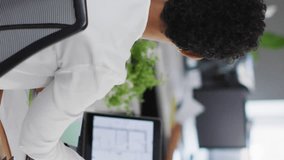 Animation of notification bars over diverse female coworkers discussing reports on computer. Digital composite, multiple exposure, social media reminder, planning, teamwork and technology concept. - Powered by Shutterstock - Get 15% off with code: PIKWIZARD15