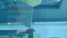 Animation of multicolored graph over diverse female coworkers discussing reports in office. Digital composite, multiple exposure, report, business, planning, teamwork and technology concept. - Powered by Shutterstock - Get 15% off with code: PIKWIZARD15