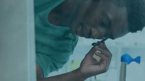 Animation of media icons over african american businessman using phone headset in office. Global business, technology and digital interface concept, digitally generated video. - Powered by Shutterstock - Get 15% off with code: PIKWIZARD15