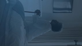 Animation of covid-19 data processing over sick african american senior woman sitting on bed. Covid-19 pandemic concept - Powered by Shutterstock - Get 15% off with code: PIKWIZARD15