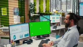 Young businessman reviewing financial data next to isolated mockup, working on report writing and finding solutions for global expansion within the business industry. Management. Camera A. - Powered by Shutterstock - Get 15% off with code: PIKWIZARD15