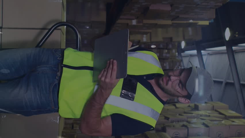 Animation of lights over caucasian male warehouse worker. Business, finance and delivery services concept digitally generated video. - Powered by Shutterstock - Get 15% off with code: PIKWIZARD15