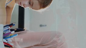 Animation of graphs over caucasian female teacher helping girl at school. School, education, finance and learning with technology concept digitally generated video. - Powered by Shutterstock - Get 15% off with code: PIKWIZARD15