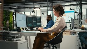 Diverse corporate staff working together on report writing in the office, collaborating on building a new development strategy. Reviewing insights to enhance efficiency and progress. Camera A. - Powered by Shutterstock - Get 15% off with code: PIKWIZARD15