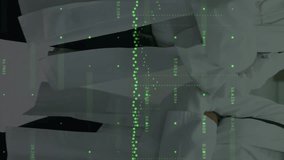 Animation of data processing over diverse male and female doctors standing together at hospital. Medical healthcare and business data technology concept - Powered by Shutterstock - Get 15% off with code: PIKWIZARD15