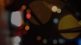 Animation of social media icons and spots of light against blurred view of night city traffic. Social media networking and business technology concept - Powered by Shutterstock - Get 15% off with code: PIKWIZARD15