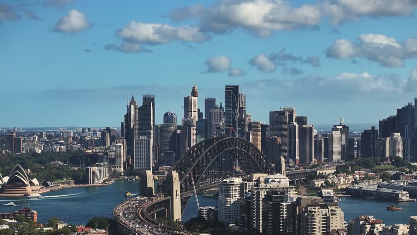 Drone aerial shot of Sydney city skyline showing the Harbour bridge and Opera House