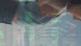 Animation of trading board, diverse coworkers walking in office, woman enjoying breeze at beach. Digital composite, multiple exposure, stock market, leisure, vacations, teamwork, investment concept. - Powered by Shutterstock - Get 15% off with code: PIKWIZARD15